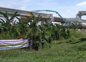Spanduk Protes Pembangunan Jalan Tol Medan-Binjai